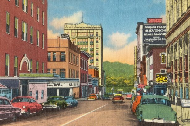 cars parked beside brown concrete building during daytime