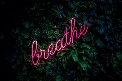 pink breathe neon sign